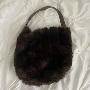 Fluffy brown hobo bag.